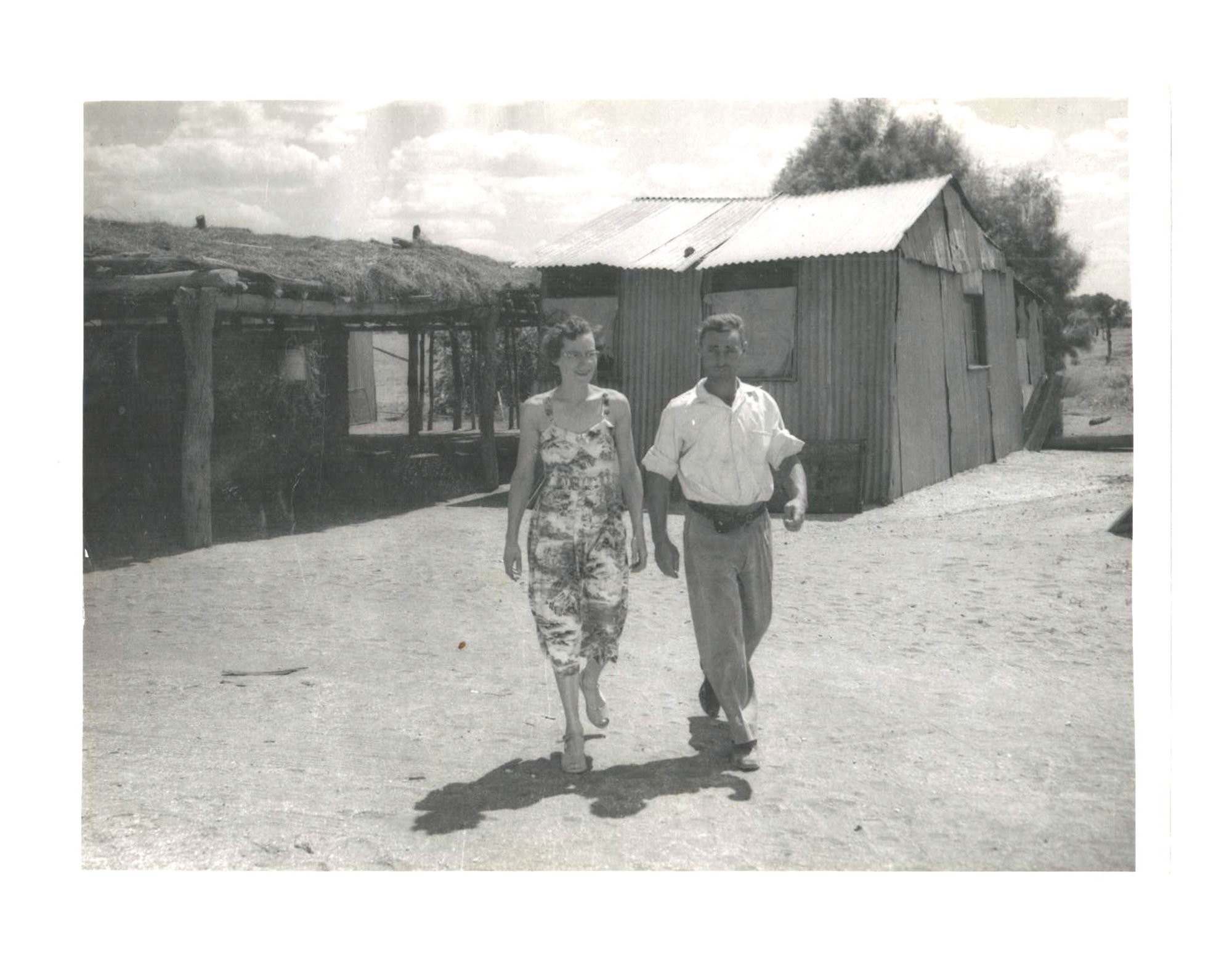Peter and Dawn Severin walking in front of the old homestead in 1958, soon after arriving at Curtin Springs